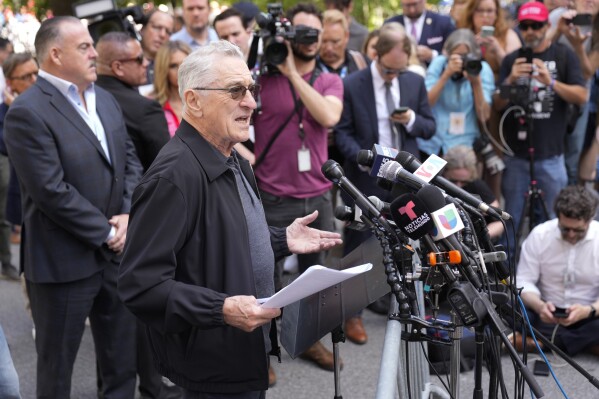 Robert De Niro speaks to reporters in support of President Joe Biden across the street from former President Donald Trump's criminal trial in New York, Tuesday, May 28, 2024. (AP Photo/Seth Wenig)