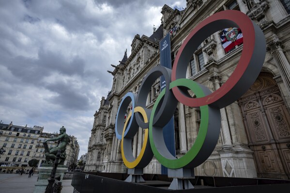 FILE - The Olympic rings are seen in front of the Paris City Hall, in Paris, on April 30, 2023. The International Gymnastics Federation is allowing Russians and Belarusians to return as 鈥渋ndividual neutral athletes鈥� without national symbols from Jan. 1, in line with the International Olympic Committee鈥檚 recommendations. However, European Gymnastics said its members voted Friday Dec. 1, 2023 not to comply with that plan. (AP Photo/Aurelien Morissard, File)
