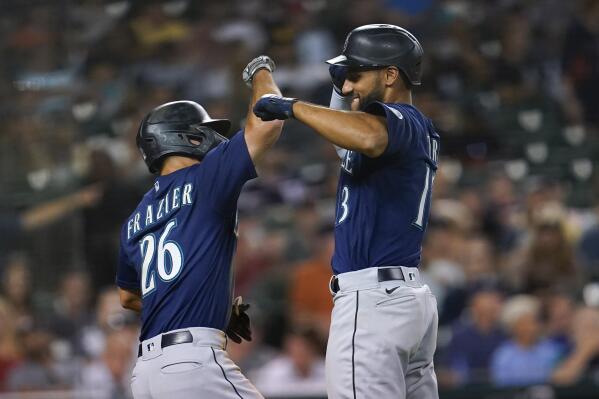 Seattle Mariners' Abraham Toro, right, celebrates his two-run home run with Adam Frazier (26) in the seventh inning of a baseball game against the Detroit Tigers in Detroit, Wednesday, Aug. 31, 2022. (AP Photo/Paul Sancya)