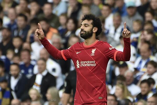 Liverpool's Mohamed Salah celebrates after scoring the opening goal during the English Premier League soccer match between Leeds United and Liverpool at Elland Road, Leeds, England, Sunday, Sept. 12, 2021. (AP Photo/Rui Vieira)