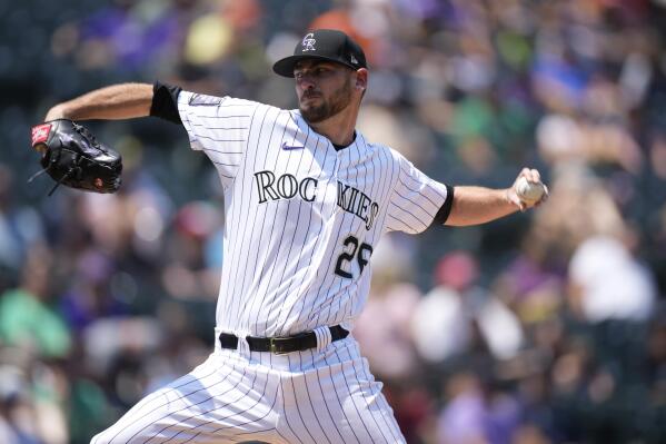 Colorado Rockies starting pitcher Austin Gomber works against the Seattle Mariners in the first inning of a baseball game Wednesday, July 21, 2021, in Denver. (AP Photo/David Zalubowski)