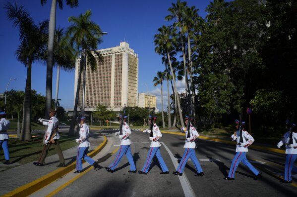 Honor guards walk outside Revolution Palace after an official reception by Cuban President Miguel Diaz-Canel to U.N. Secretary General Antonio Guterres who will attend the G77 + China summit in Havana, Cuba, Thursday, Sept. 14, 2023. (AP Photo/Ramon Espinosa)