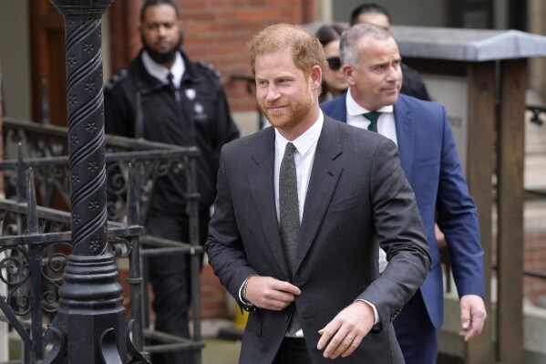 FILE - Britain's Prince Harry leaves the Royal Courts Of Justice in London, Thursday, March 30, 2023. Prince Harry scored a tactical victory in his battles with British tabloids Friday, March 1, 2024, when government ministers said he could use confidential documents that show payments by the publisher of the Daily Mail to private investigators who allegedly snooped on him and several celebrities. (AP Photo/Kirsty Wigglesworth, File)