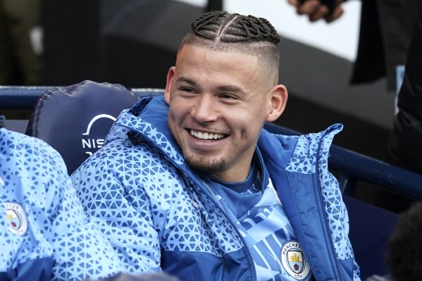 FILE - Manchester City's Kalvin Phillips sits on the bench before the English Premier League soccer match between Manchester City and Crystal Palace at the Etihad Stadium in Manchester, England, Saturday, Dec. 16, 2023. Kalvin Phillips has completed his move to West Ham on a six-month loan deal from Manchester City where the England midfielder had fallen out of favor with Pep Guardiola. (AP Photo/Dave Thompson, File)