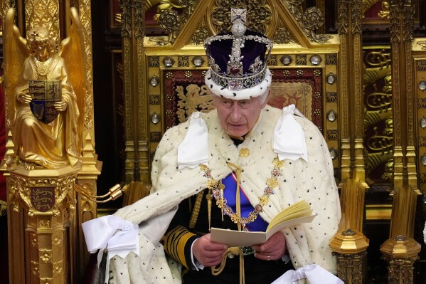 Britain's King Charles III speaks during the State Opening of Parliament at the Palace of Westminster in London, Tuesday, Nov. 7, 2023. King Charles III sits on a gilded throne to read out the King's Speech, a list of planned laws drawn up by the Conservative government and aimed at winning over voters ahead of an election next year. (AP Photo/Kirsty Wigglesworth, Pool)