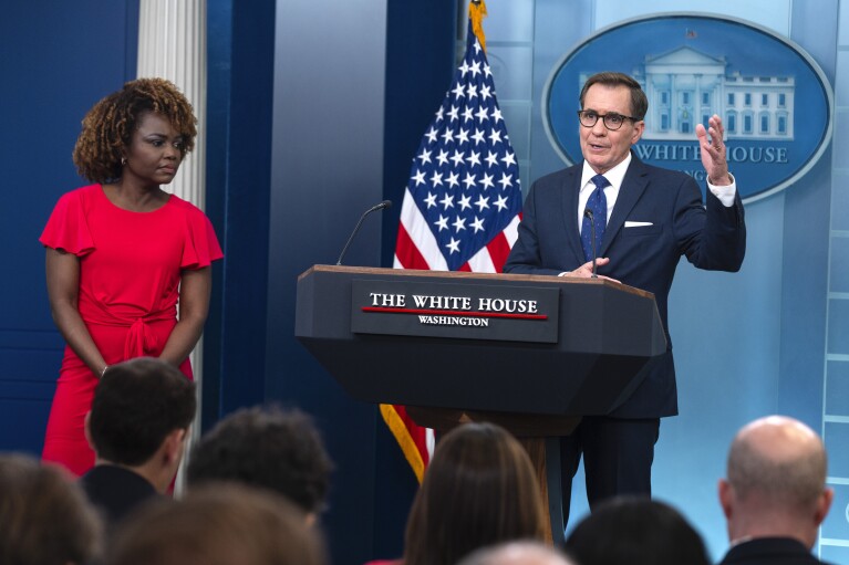 White House Press Secretary Karine Jean-Pierre listens to John Kirby, White House National Security Communications Advisor, during a press briefing at the White House, Thursday, April 4, 2024, in Washington.  (AP Photo/Evan Vucci)
