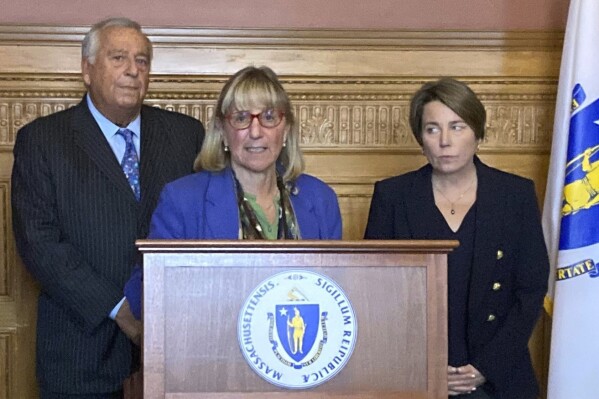 Massachusetts Senate President Karen Spilka, flanked by fellow Democrats, House Speaker Ronald Mariano, left, and Gov. Maura Healey speaks during a news conference on Monday, Jan. 22, 2024 in Boston. Spilka is championing a sweeping gun bill that would ensuring accountability for those who own ghost guns, toughen the state's existing prohibition on assault weapons, and make it illegal to possess devices that convert semi-automatic firearms into fully automatic machine guns. (AP Photo/Steve LeBlanc)