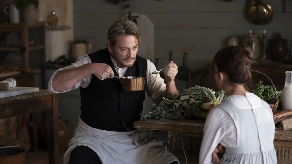 This image released by IFC Films shows Beno卯t Magimel in a scene from "The Taste of Things." (Carole Bethuel/IFC Films via 麻豆传媒app)
