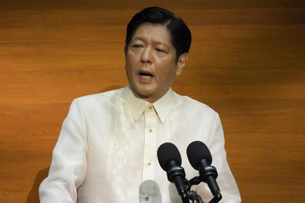 FILE - Philippine President Ferdinand Marcos Jr. delivers his first state of the nation address in, Quezon city, Philippines, July 25, 2022. Newly elected President Ferdinand Marcos Jr. said Monday Aug. 1, 2022 the Philippines has no plan to rejoin the International Criminal Court in a decision backing his predecessor's stance but rejects that of human rights activists. (AP Photo/Aaron Favila, Pool, File)