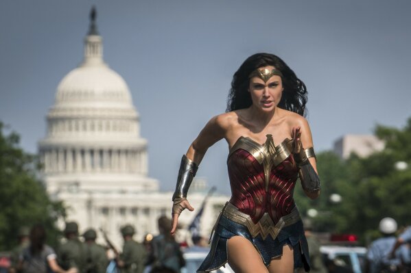 This image released by Warner Bros. Pictures shows Gal Gadot as Wonder Woman in a scene from “Wonder Woman 1984." Warner Bros. on Tuesday delayed the summer release of the film to Aug. 14 instead of June 5 due to the coronavirus pandemic. (Clay Enos/Warner Bros Pictures via AP)