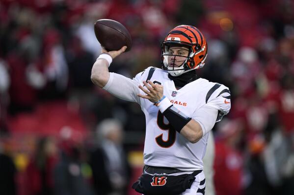 FILE - Cincinnati Bengals quarterback Joe Burrow throws a pass against the Kansas City Chiefs during the first half of the AFC championship NFL football game Jan. 29, 2023, in Kansas City, Mo. The Bengals exercised the fifth-year contract option on Burrow as they move toward signing him to a long-term deal. The Bengals said they made the “mechanical step" Tuesday, April 25, as they work with Burrow and his representatives toward securing him for the future. (AP Photo/Brynn Anderson, File)