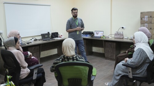 In this photo taken Tuesday, June 13, 2023, Jaser Alharasis, co-founder and CEO of a start-up that trains young Jordanians in robotics and artificial intelligence called Robotna, talks to his team in east Amman, Jordan. (AP Photo/Raad Adayleh)