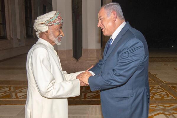 In this photo was released by Oman News Agency, Oman's Sultan Qaboos, left, receives Israeli Prime Minister Benjamin Netanyahu in Muscat, Oman, Friday, Oct. 26, 2018. Israel and Oman do not have diplomatic relations. The meeting was the first between leaders of the two countries since 1996 and former Israeli premier Yitzhak Rabin made a similar surprise visit to Oman two years earlier. (Israeli Prime Minister's Office via AP)