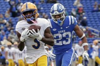FILE - Pittsburgh wide receiver Jordan Addison (3) hauls in a pass for a touchdown against Duke safety Lummie Young IV (23) during the first half of an NCAA college football game Nov. 6, 2021, in Durham, N.C. Addison is exploring his options. The 2021 Biletnikoff Award winner as the nation's top receiver is in the NCAA transfer portal. Addison put in his paperwork by the May 1 deadline and his entry became visible Tuesday. (AP Photo/Chris Seward, File)