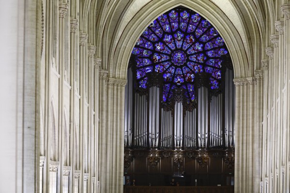 A view of the Great Organ and the Western Rose window before the inaugural Mass, with the consecration of the high altar, at the Notre-Dame de Paris Cathedral, five-and-a-half years after a fire ravaged the Gothic masterpiece, as part of ceremonies to mark the Cathedral's reopening after its restoration, in Paris, France, Sunday, Dec. 8, 2024. (Sarah Meyssonnier/Pool Photo via AP)