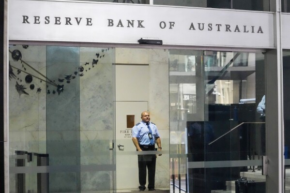 A security guard stands inside the Reserve Bank building in the central business district in Sydney, Australia, Tuesday, Nov. 7, 2023. Australia's central bank has lifted interest rates for the first time in five months, taking the official cash rate up by a quarter of a percentage point to 4.35 per cent. (AP Photo/Mark Baker)