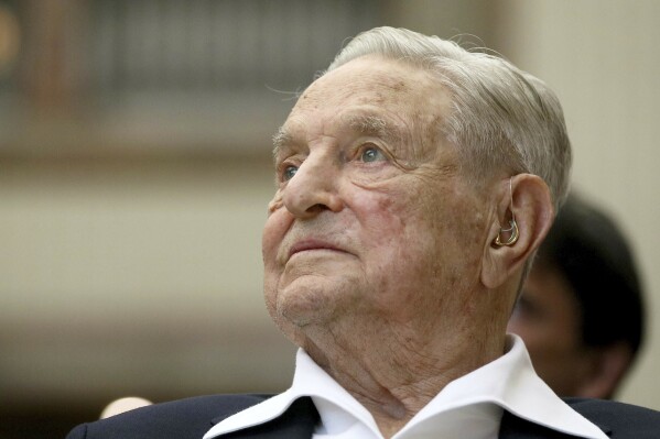 FILE - George Soros, founder and chairman of the Open Society Foundations, attends the Joseph A. Schumpeter award ceremony, June 21, 2019, in Vienna, Austria. Open Society Foundations plan to significantly curtail their work in Europe and lay off much of their staff on the continent, the foundations' leaders told staff in Berlin, according to an internal email and several current employees, who say the decision is painful and perplexing. (AP Photo/Ronald Zak, File)