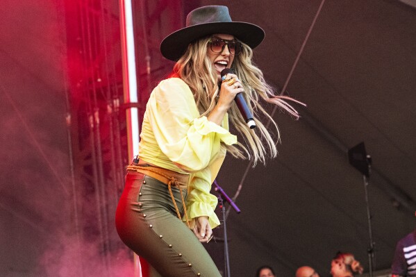 FILE - Lainey Wilson performs on day one of the Lollapalooza Music Festival on Thursday, Aug. 3, 2023, at Grant Park in Chicago. The Country Music Association announced the nominees for the 57th annual CMA Awards on Thursday, Sept. 7, with Wilson leading the nominations for the second year in a row. (Photo by Amy Harris/Invision/AP)