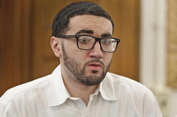 FILE - Emanuel Lopes attends the first day of his trial at Norfolk Superior Court, Thursday June 8, 2023, in Dedham, Mass. Lopes, charged with killing a police officer and an innocent bystander in July 2018, was found guilty Friday, Feb. 16, 2024, of multiple charges, including murder. It was the second trial for Emanuel Lopes after Norfolk Superior Court Judge Beverly Cannone declared a mistrial last year when a jury couldn’t reach a unanimous verdict. (Greg Derr/The Patriot Ledger via AP, Pool, File)
