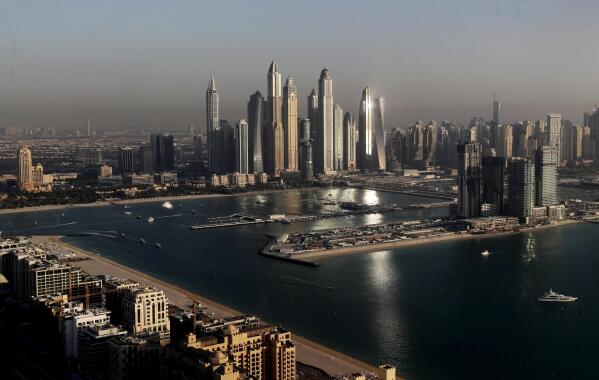 FILE - Part of the skyline of Dubai in United Arab Emirates is seen from the observation deck of "The View at The Palm Jumeirah" on April 6, 2021. U.S. spies caught Russian intelligence officers boasting that they had convinced the United Arab Emirates “to work together against US and UK intelligence agencies,” according to a purported American document posted online as part of a major U.S. intelligence breach. (AP Photo/Kamran Jebreili, File)