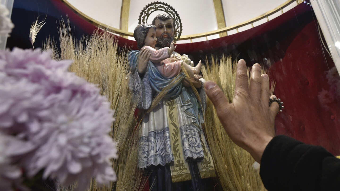 Faced with President Milei’s tough austerity measures, unemployed Argentines turn to the patron saint of work