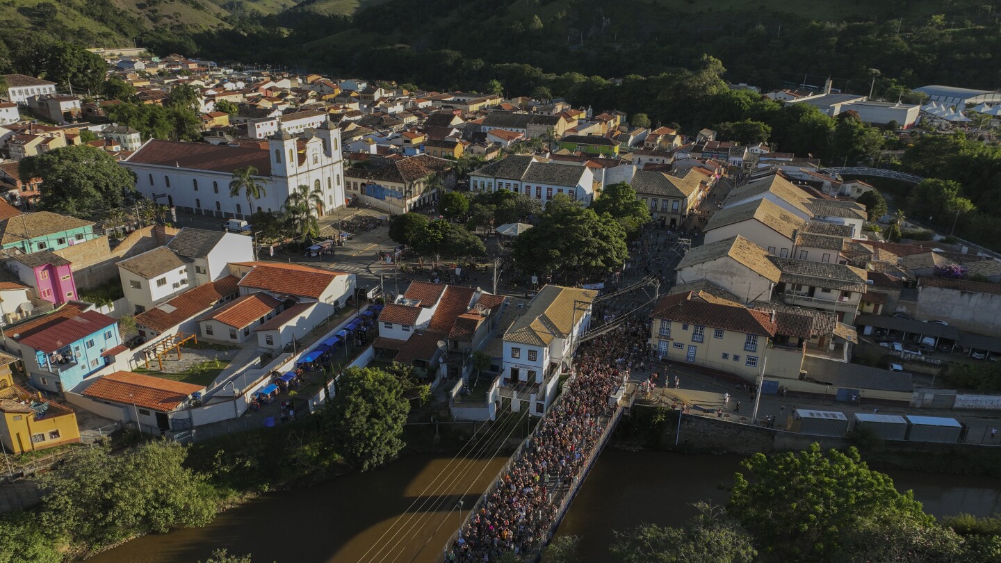 Families and revelers party side-by-side in a traditional Carnival in Sao Paulo's countryside