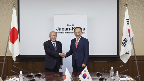 In this photo provided by Japan's Finance Ministry, Japanese Finance Minister Shunichi Suzuki, left, and South Korea's Economy and Finance Minister Choo Kyungho shake hands as they pose for a photo before their meeting at the finance ministry in Tokyo, Thursday, June 29, 2023. Japan and South Korea agreed Thursday to revive a currency swap agreement for times of crisis, in the latest sign of warming ties as the countries work to smooth over historical antagonisms dating back nearly a century. (Japan's Finance Ministry via AP)