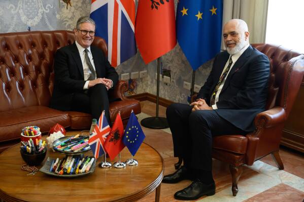 Britain's Prime Minister Keir Starmer, left, is welcomed by Albania's Prime Minister Edi Rama at the Kryeministria in Tirana, Albania, Thursday May 15, 2025. (Leon Neal/Pool via AP)