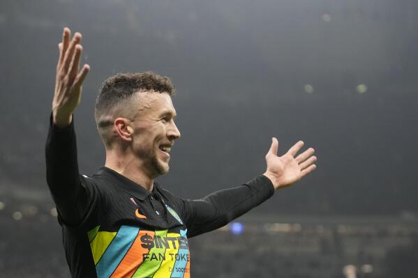 Inter Milan's Ivan Perisic celebrates after he scored his side's second goal during the Serie A soccer match between Inter Milan and Napoli at San Siro Stadium, in Milan, Italy, Sunday, Nov. 21, 2021. (AP Photo/Antonio Calanni)