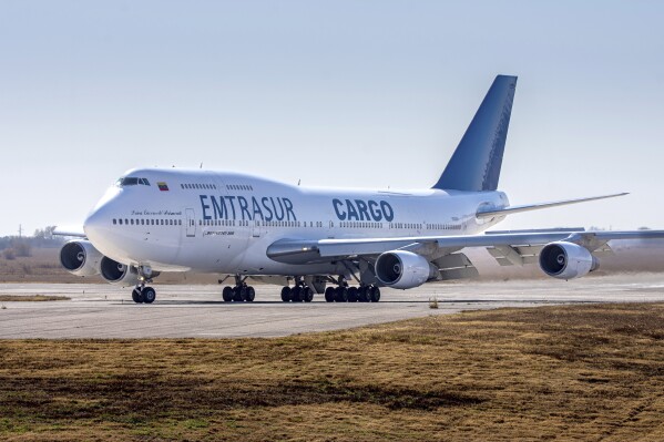 FILE - A Venezuelan-owned Boeing 747, operated by Venezuela's state-owned Emtrasur cargo line, taxis on the runway after landing in Cordoba, Argentina, June 6, 2022. The U.S. government said Monday, Feb. 12, 2024, it has seized a Boeing 747 cargo plane that officials say was previously sold by a sanctioned Iranian airline to a state-owned Venezuelan firm in violation of American export control laws. (AP Photo/Sebastian Borsero, File)