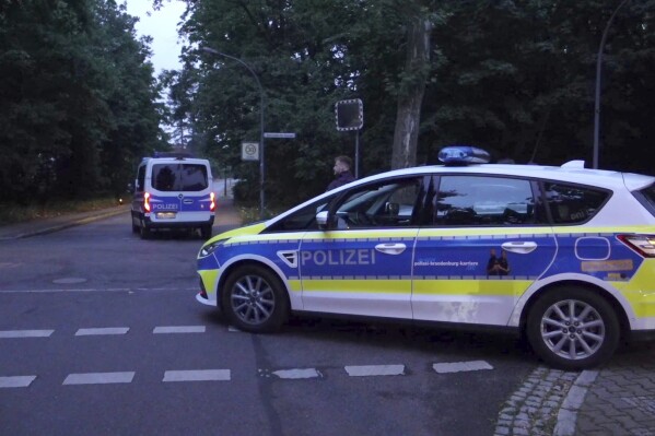 Police patrol during a search operation for a dangerous wild animal near the village of Kleinmachnow in the southern suburbs of Berlin, Germany, Thursday, July 20, 2023. German authorities warned people in Berlin's southern suburbs on Thursday to watch out for a potentially dangerous animal, suspected to be a lioness, that was on the loose. (Sven Kaeuler/TNN/dpa via AP)