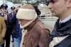 In this picture taken from a video released by Italian Carabinieri on Monday, Jan. 16, 2023, top Mafia boss Matteo Messina Denaro, center, leaves an Italian Carabinieri barrack soon after his arrest at a private clinic in Palermo, Sicily, after 30 years on the run, Monday, Jan. 16, 2023. (Carabinieri via AP)