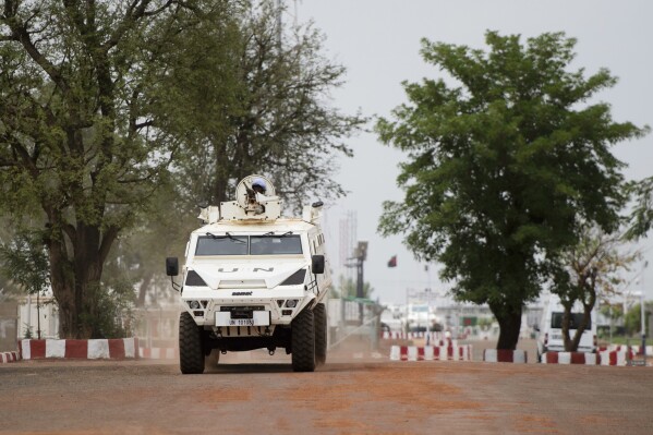FILE- A United Nations vehicle is seen on the MINUSMA Main Operations Base in Bamako, Mali, June 23, 2018. The pending pullout of U.N. peacekeepers from Mali is creating worries about what the withdrawal will mean for thousands of citizens who built livelihoods at and around the mission's bases.(Sean Kilpatrick/The Canadian Press via AP-File)