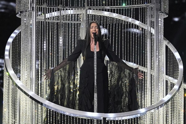 Yuval Raphael from Israel performs the song "New Day Will Rise" during the dress rehearsal for the second semi-final of the 69th Eurovision Song Contest, in Basel, Switzerland, Wednesday, May 14, 2025. (AP Photo/Martin Meissner)
