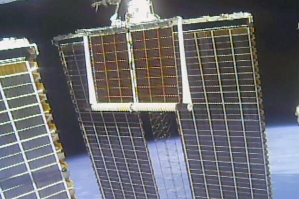 In this image taken from NASA video, a solar panel is unfolded at the International Space Station, Sunday, June 20 2021. (NASA via AP)