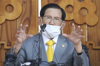 FILE - In this March 2, 2020 file photo, Lee Man-hee, a leader of Shincheonji Church of Jesus, speaks to the media during the press conference in Gapyeong, South Korea. Singaporean authorities on Wednesday, Nov. 11, have arrested 21 people who are thought to be connected to a secretive South Korean religious sect that was widely blamed for thousands of virus infections in that country.(Kim Ju-sung/Yonhap via AP, File)