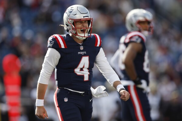 New England Patriots quarterback Bailey Zappe (4) reacts after a missed play during the second half of an NFL football game against the New Orleans Saints, Sunday, Oct. 8, 2023, in Foxborough, Mass. (AP Photo/Michael Dwyer)