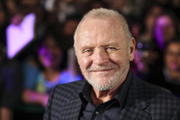 FILE - In this Feb. 15, 2011 file photo, Anthony Hopkins smiles while posing for photos prior to the premiere of his new film "The Rite" in Mexico City.  “Nomadland” has won four prizes, including best picture, at the British Academy Film Awards on Sunday, April 11, 2021. The film’s director, Chloe Zhao, became only the second woman to win the best director trophy, and star Frances McDormand was named best actress. “Nomadland” also took the cinematography prize on Sunday. Emerald Fennell’s revenge comedy “Promising Young Woman” was named best British film, while the best actor trophy went to 83-year-old Anthony Hopkins for playing a man grappling with dementia in “The Father.” An event that was criticized in the recent past with the label #BAFTAsSoWhite rewarded a diverse group of talents, during a pandemic-curbed ceremony at London’s Royal Albert Hall. (AP Photo/Alexandre Meneghini, File)