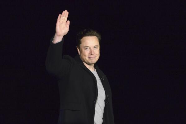 FILE - SpaceX's Elon Musk waves while providing an update on Starship, on Feb. 10, 2022, near Brownsville, Texas. Musk's Twitter has dissolved its Trust and Safety Council, the advisory group of around 100 independent civil, human rights and other organizations that the company formed in 2016 to address hate speech, child exploitation, suicide, self-harm and other problems on the platform. The council had been scheduled to meet with Twitter representatives Monday night, Dec. 12. But Twitter informed the group via email that it was disbanding it shortly before the meeting was to take place, according to multiple members. (Miguel Roberts/The Brownsville Herald via AP, File)