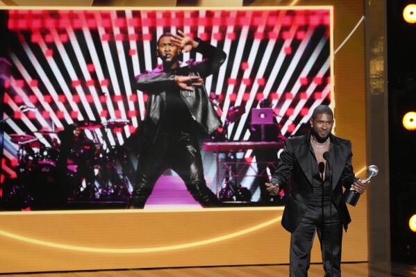 Usher speaks to the audience after winning Entertainer of the Year during the 55th NAACP Image Awards, Saturday, March 16, 2024, at The Shrine Auditorium in Los Angeles. (AP Photo/Chris Pizzello)