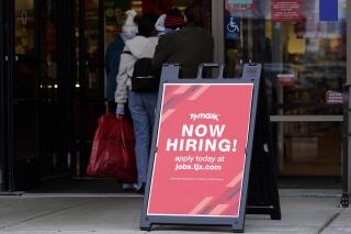 FILE - Hiring sign is displayed outside of a retail store in Vernon Hills, Ill., Saturday, Nov. 13, 2021. U.S. employers advertised fewer jobs in May 2022 as the economy has shown signs of weakening, though the overall demand for workers remained strong.  Employers advertised 11.3 million jobs at the end of May, the Labor Department said Wednesday, July 6, 2022,  down from nearly 11.7 million in March, the highest level on records that date back more than 20 years. (AP Photo/Nam Y. Huh, File)