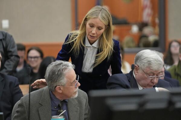 Gwyneth Paltrow speaks with retired optometrist Terry Sanderson, left, as she walks out of the courtroom following the reading of the verdict in their lawsuit trial, Thursday, March 30, 2023, in Park City, Utah. Paltrow won her court battle over a 2016 ski collision at a posh Utah ski resort after a jury decided Thursday that the movie star wasn’t at fault for the crash. (AP Photo/Rick Bowmer, Pool)