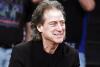 FILE - Comedian Richard Lewis attends an NBA basketball game in Los Angeles on Dec. 25, 2012. Lewis is retiring from stand-up following four surgeries and a diagnosis of Parkinson’s disease. The 75-year-old “Curb Your Enthusiasm” star who is known for wearing all-black and exploring his neuroses onstage posted a video Monday to Twitter explaining his various health issues. (AP Photo/Alex Gallardo, File)