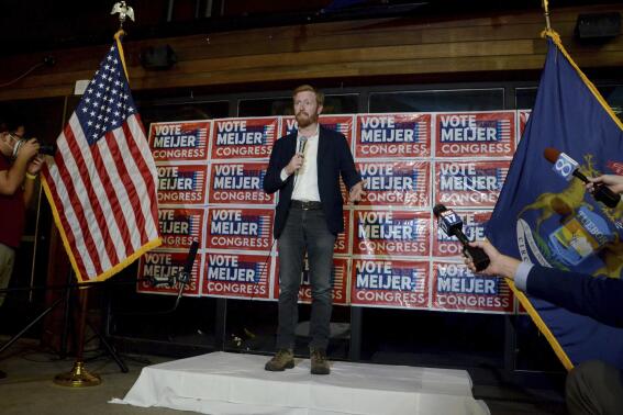 Rep. Peter Meijer, R-Mich., speaks with the media late Tuesday, Aug. 2, 2022, in Grand Rapids, Mich. He is running against John Gibbs in the Republican primary in Michigan's 3rd Congressional District. (Katy Batdorff/Detroit News via AP)
