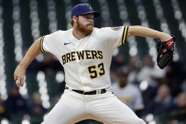 Milwaukee Brewers starting pitcher Brandon Woodruff (53) throws to the Pittsburgh Pirates during the first inning of a baseball game, Wednesday, April 20, 2022, in Milwaukee. (AP Photo/Jeffrey Phelps)