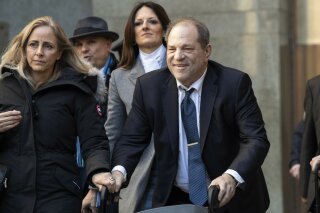 FILE - In this Feb. 21, 2020, file photo, Harvey Weinstein leaves the courthouse during jury deliberations in his rape trial in New York. With Weinstein facing sentencing this week, his lawyers argued Monday, March 9, that the disgraced movie mogul deserves mercy in his New York City rape case because he's already suffered a "historic" fall from grace and is dealing with serious health issues. (AP Photo/Mary Altaffer, File)
