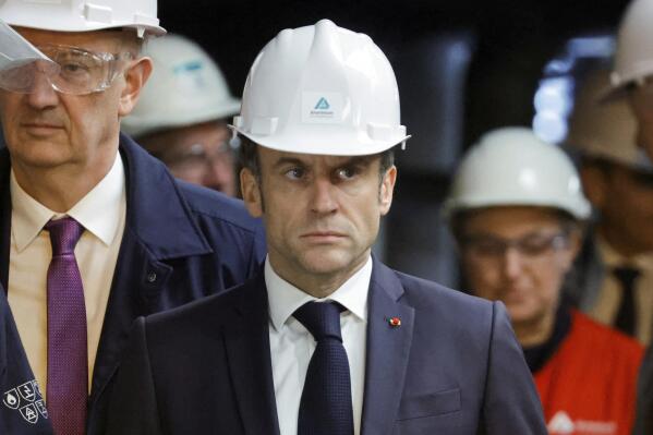 French President Emmanuel Macron visits the Aluminium Dunkerque factory in Dunkirk, northern France, Friday, May 12, 2023. Macron announced two major investments in the Dunkirk region, both in the battery sector: one worth 5.2 billion euros by Taiwan's group Prologium, the other one via a joint venture of China's XTC with French giant Orano worth 1.5 billion euros. (Pascal Rossignol/Pool Photo via AP)