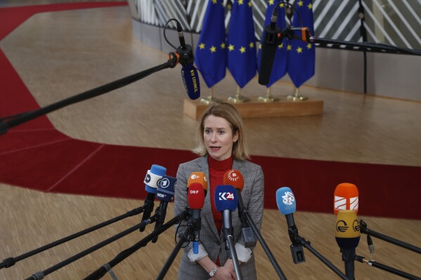 Estonia's Prime Minister Kaja Kallas talks to journalists as he arrives for an EU summit in Brussels, Thursday, Feb. 1, 2024. European Union leaders meet in Brussels for a one day summit to discuss the revision of the Multiannual Financial Framework 2021-2027, including support for Ukraine. (AP Photo/Omar Havana)