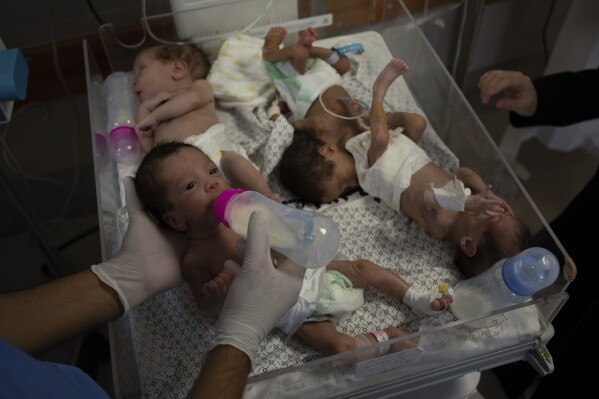 Medics prepare premature babies for transport to Egypt after they were evacuated from Shifa Hospital in Gaza City to a hospital in Rafah, Gaza Strip, Monday, Nov. 20, 2023. (AP Photo/Fatima Shbair)