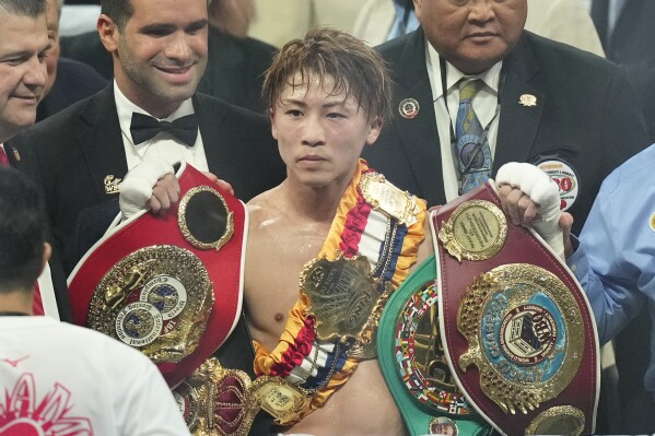 Japanese champion Naoya Inoue celebrates after defending his super bantamweight world title at the Ariake Arena in Tokyo, Friday, Jan.24, 2025. (AP Photo/Hiro Komae, File)
